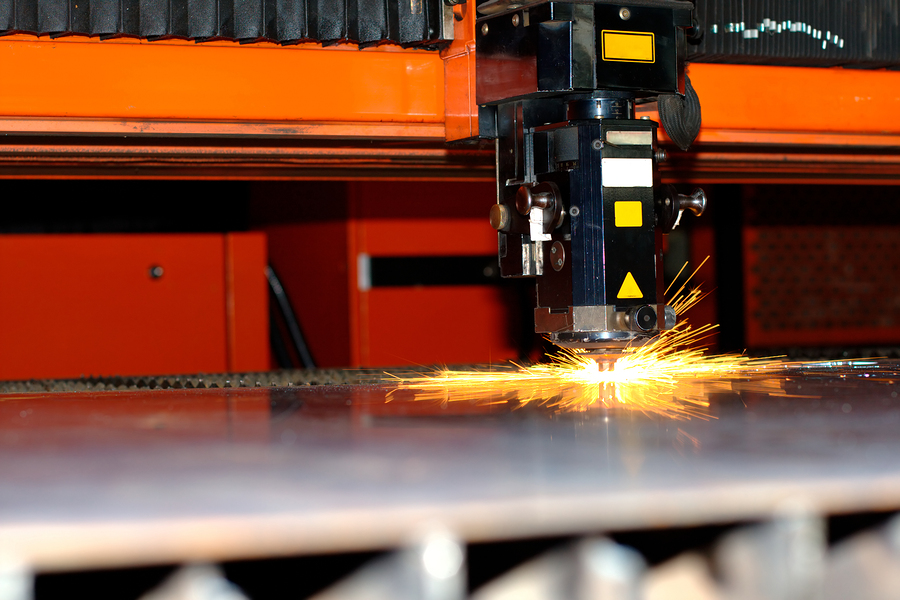 Photo of the industrial laser with sparks flying around